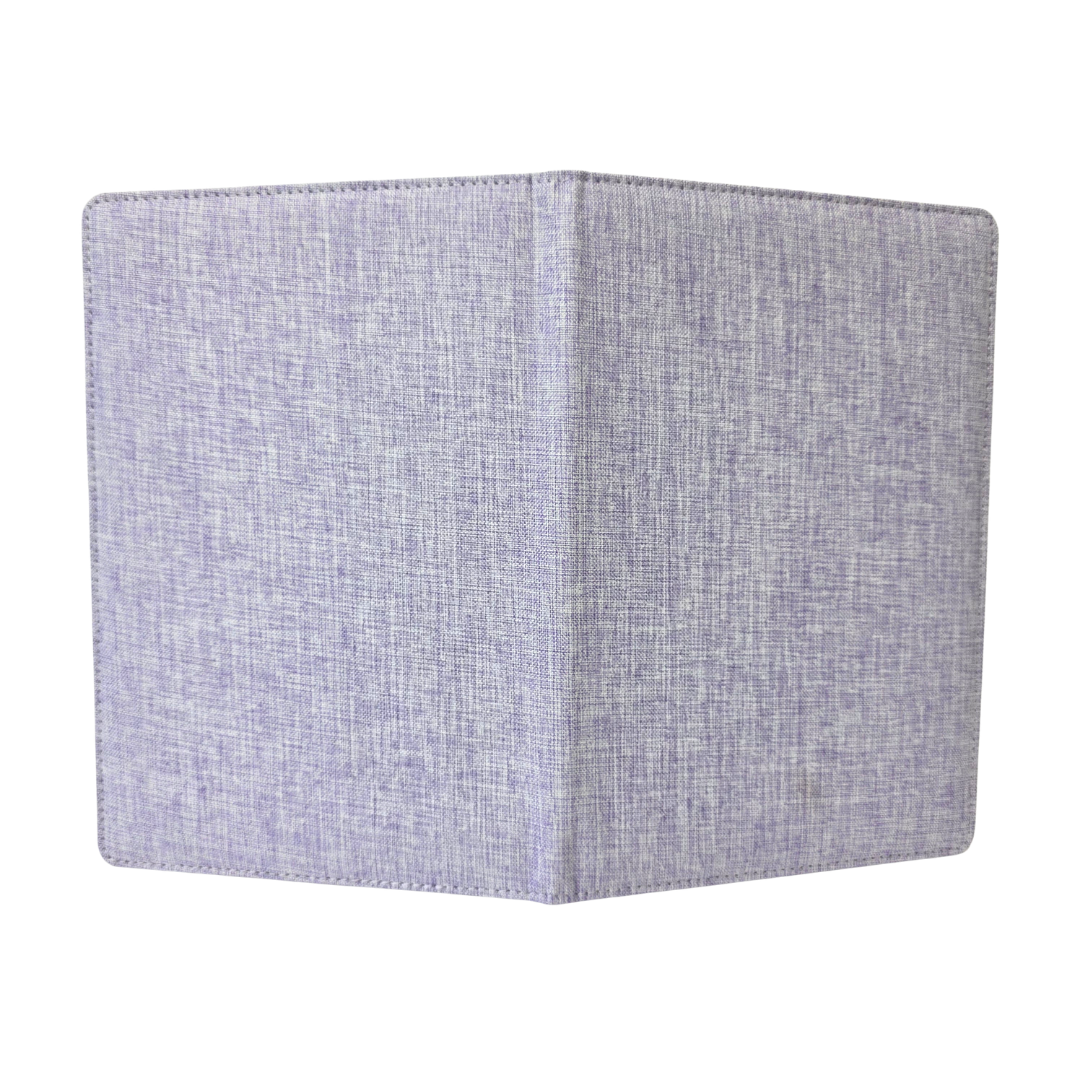 Textured purple fabric journal cover on a white background