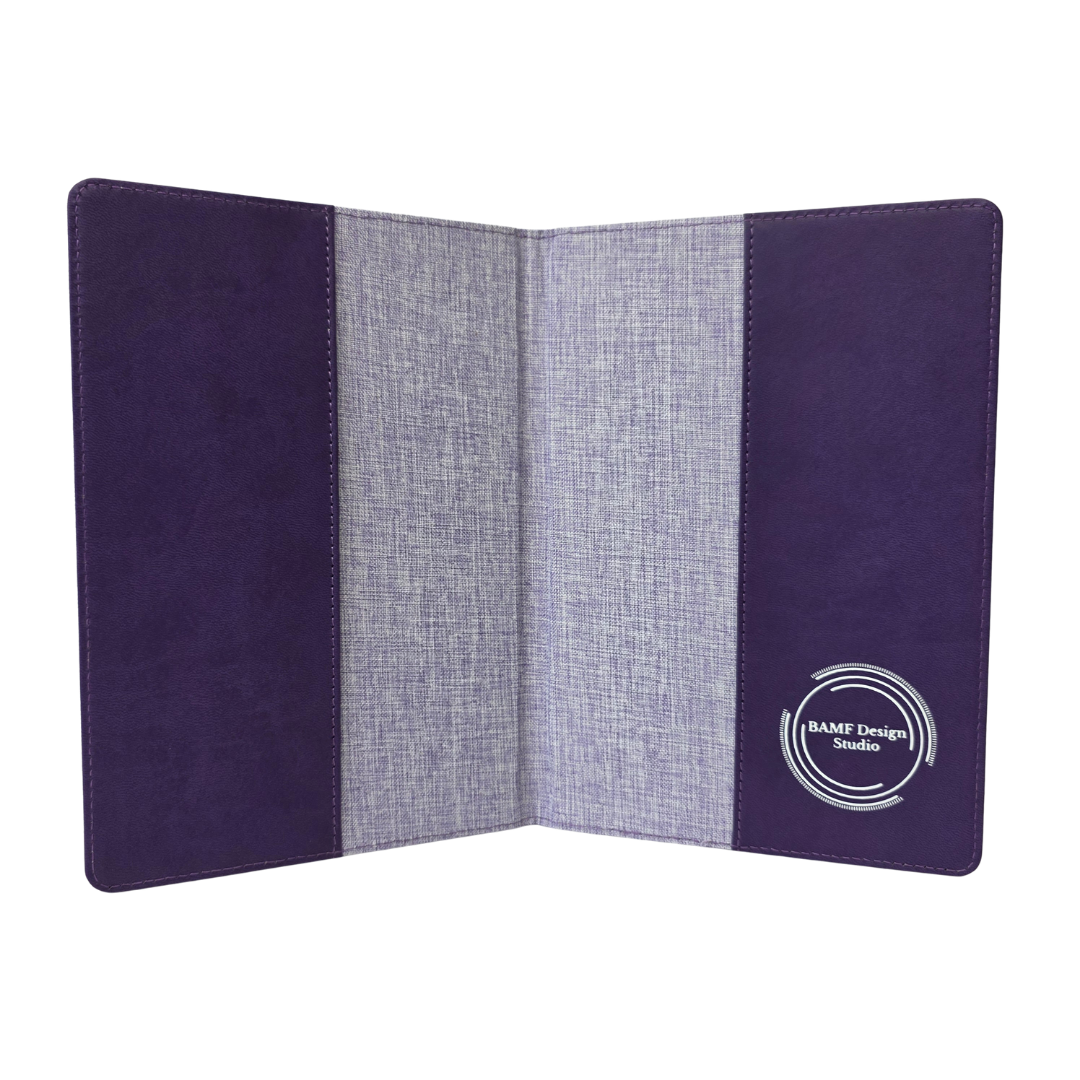 Inside of a journal cover. Purple fabric panel with a brand logo on a white background