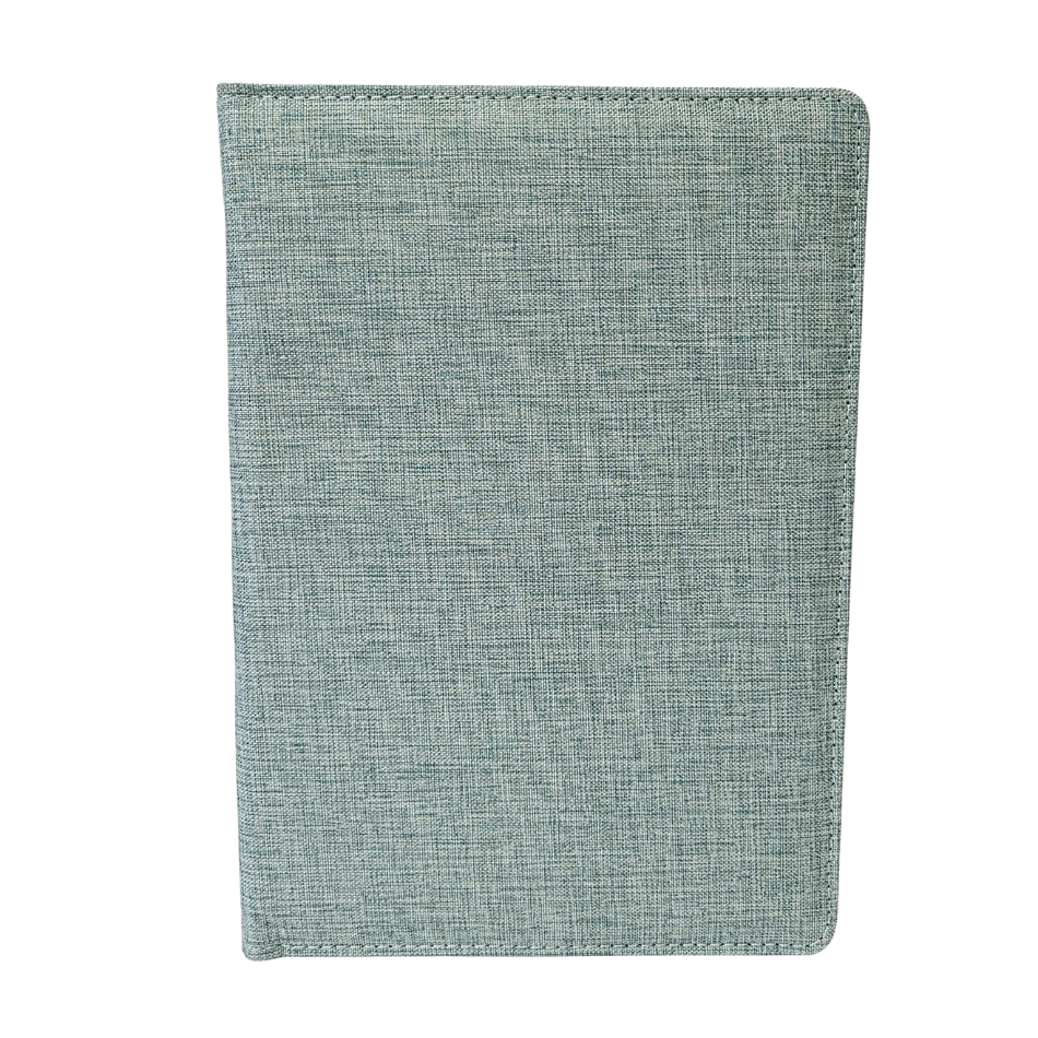 Green fabric notebook on a white background
