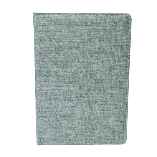 Green fabric notebook on a white background