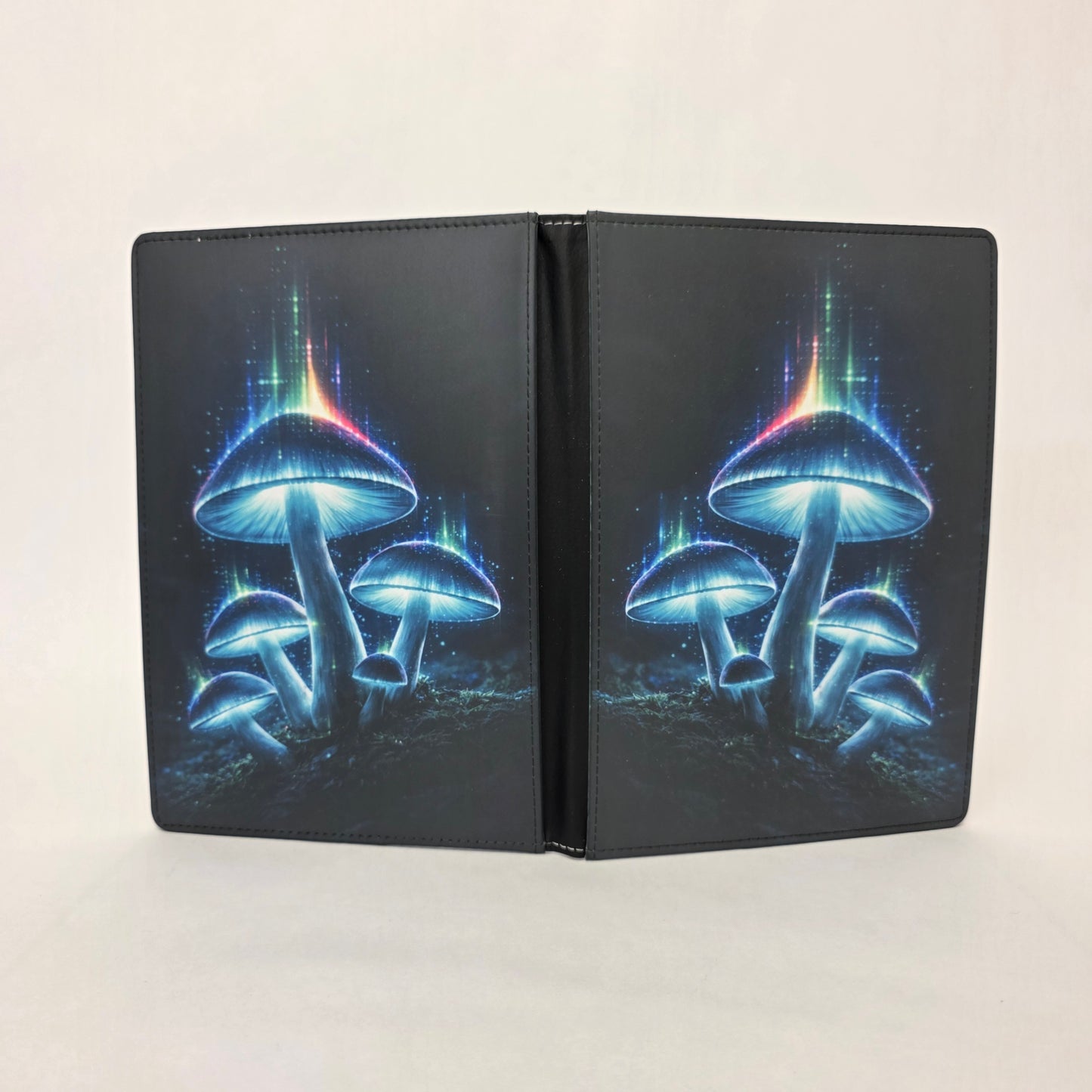 Faux leather journal cover with glowing blue mushrooms design on a white background