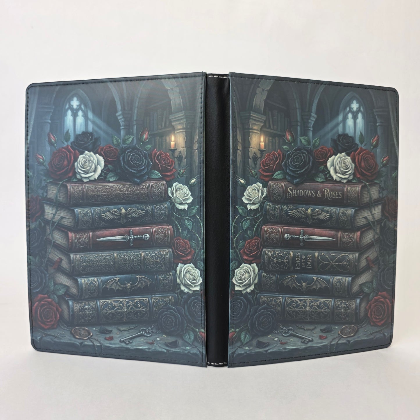 Notebook cover with books and roses design on a white background