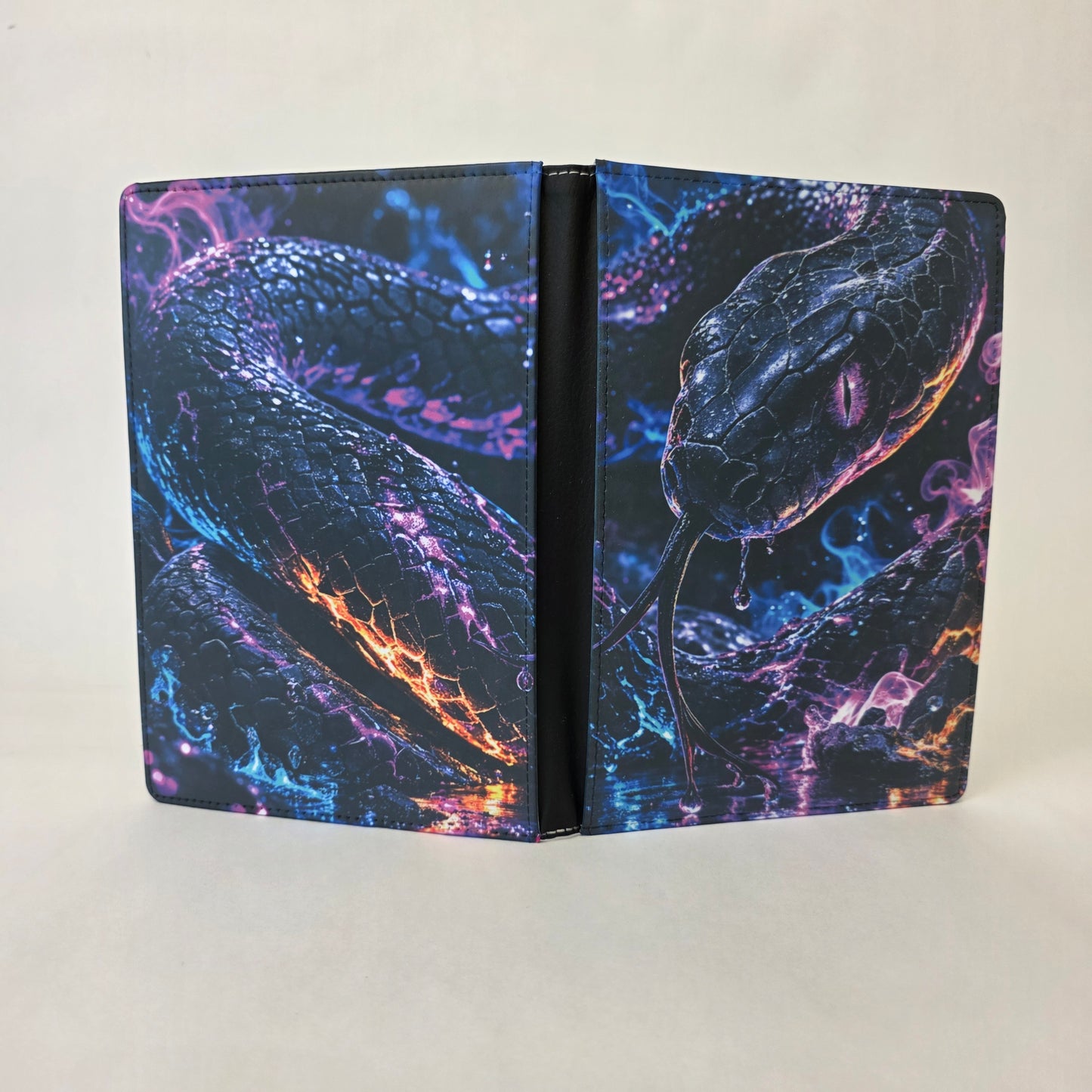 Notebook with a snake design on a black background
