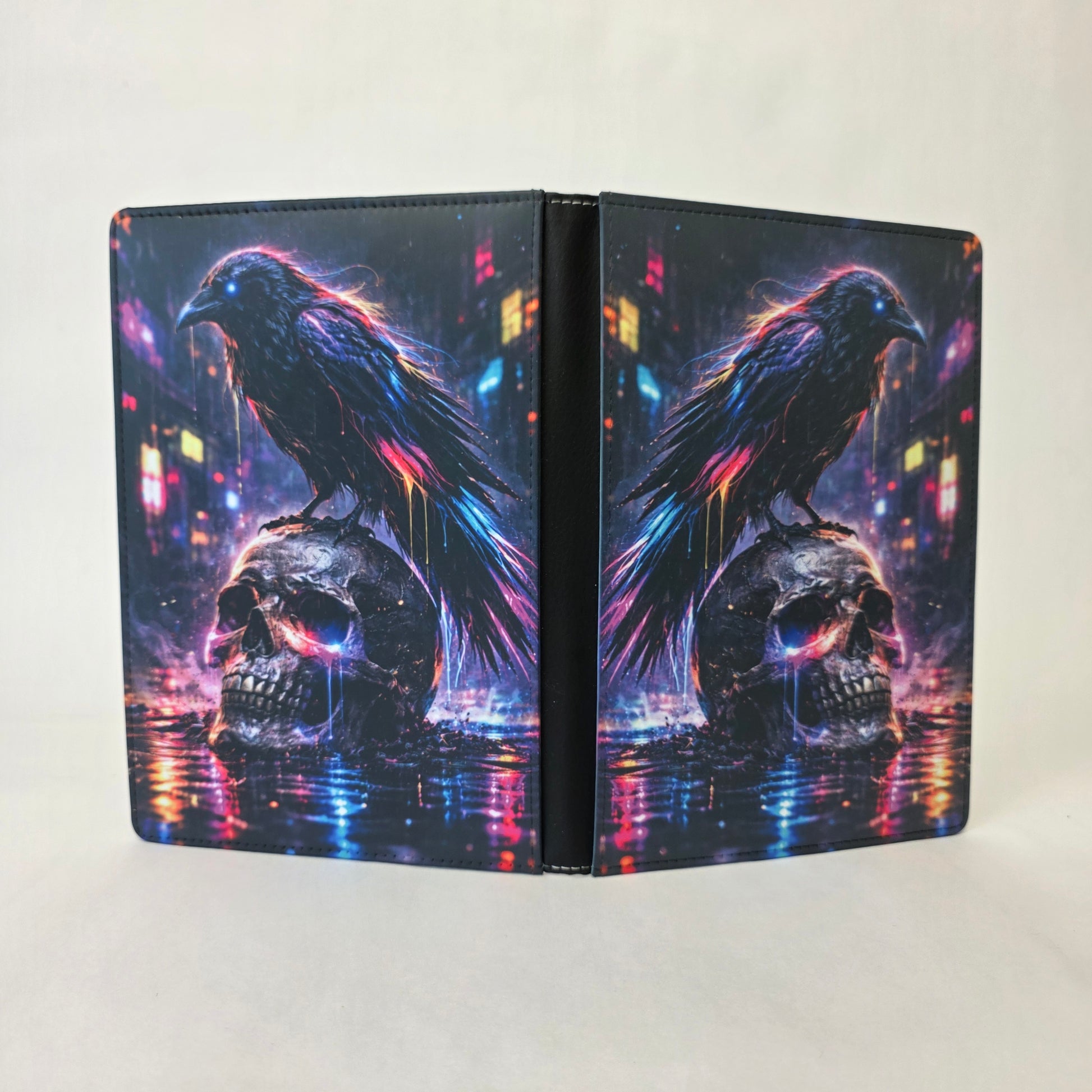 Colorful journal design with a raven on a skull against a colorful cityscape background