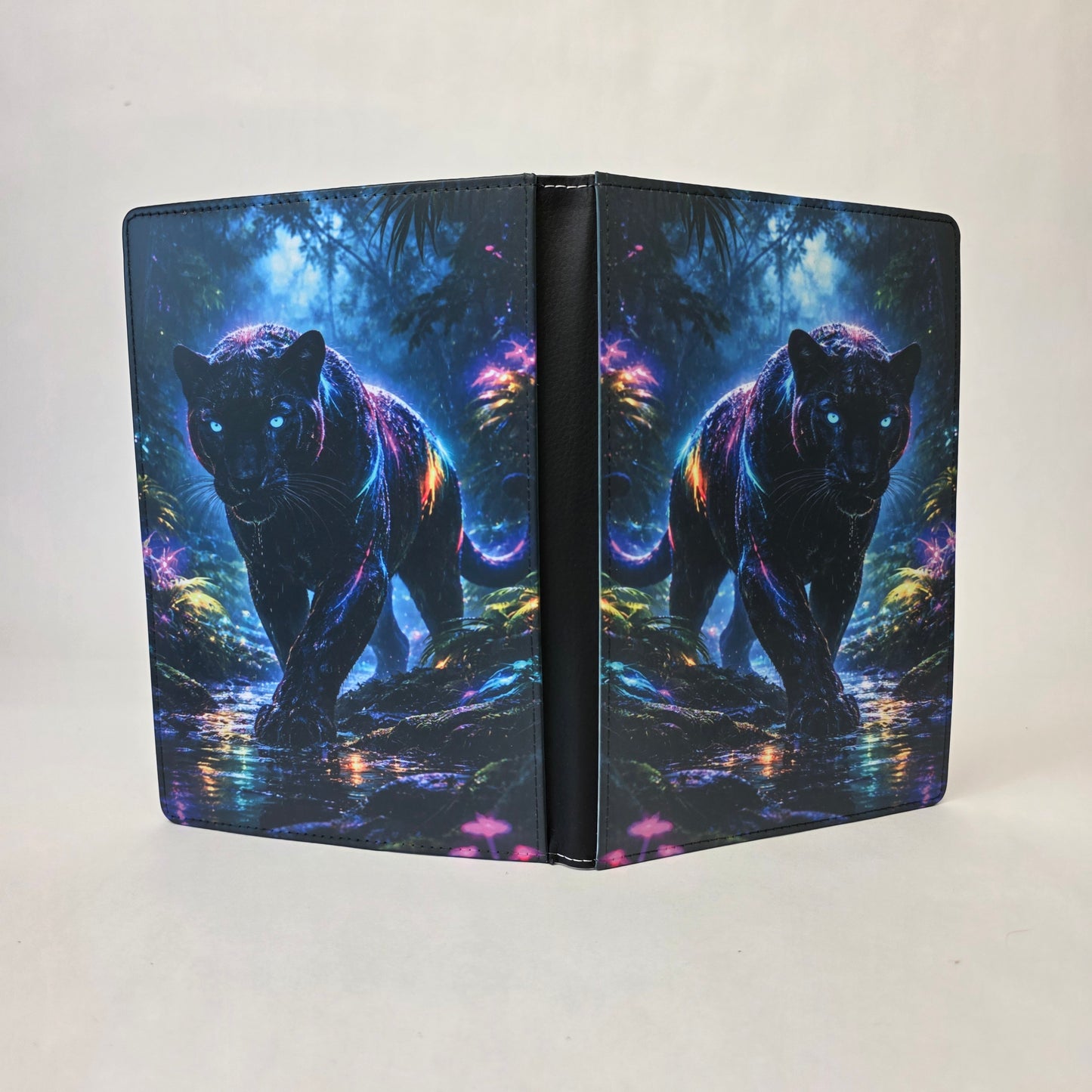 A journal cover with a neon image of a panther on a white background.