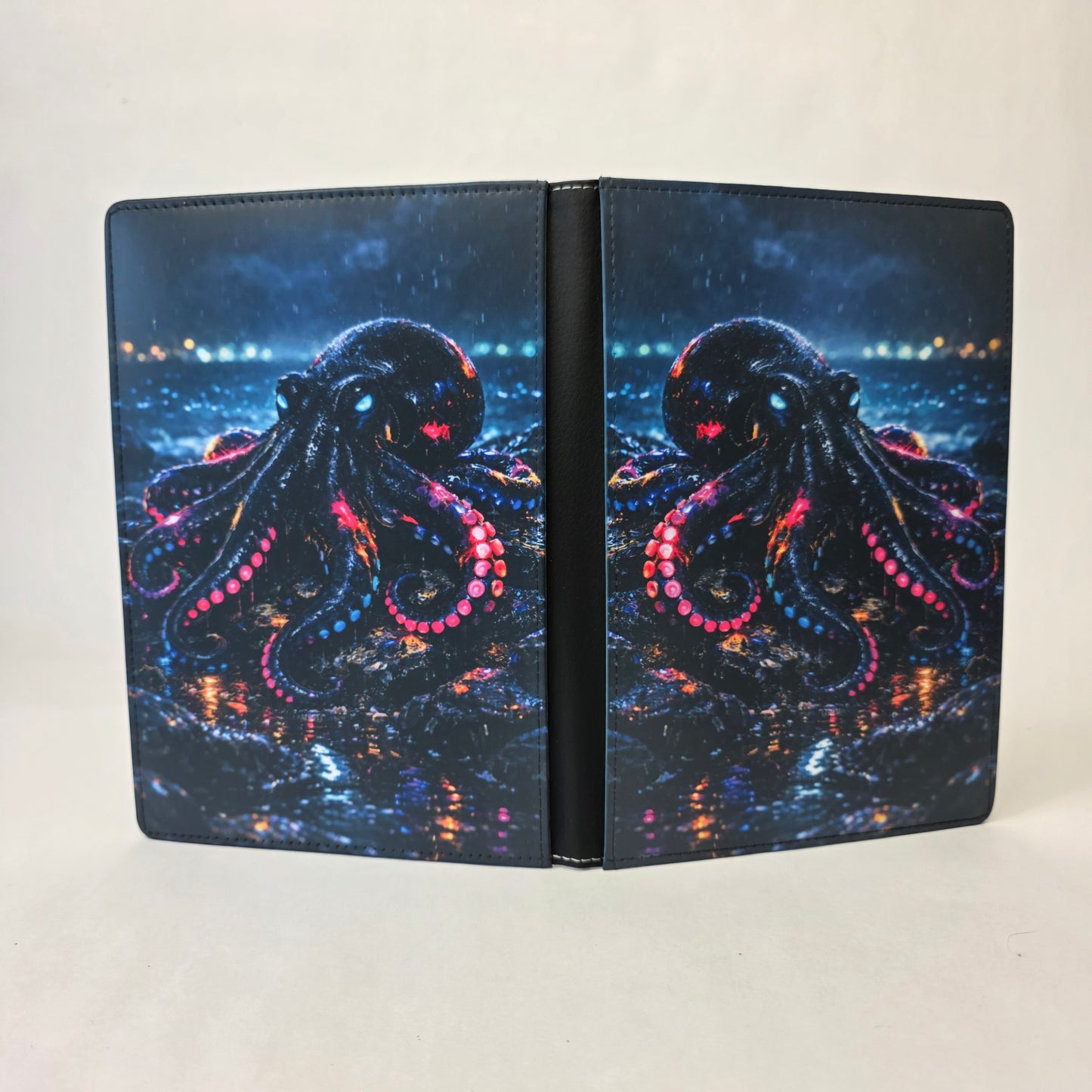 A journal cover with a neon octopus sitting on a rock.
