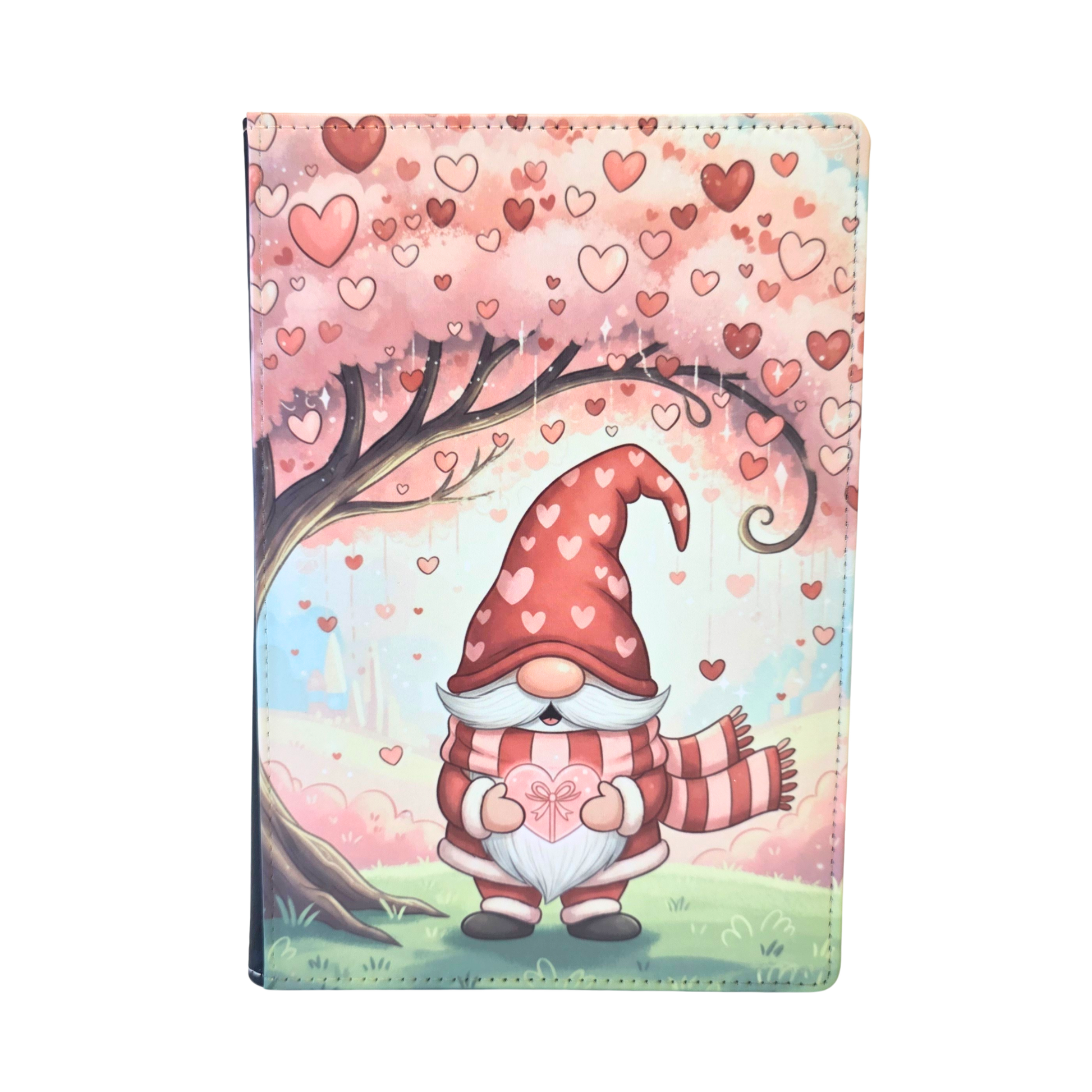 Journal cover with Gnome heart-themed design. A gnome standing beneath a pink tree. Pink and red hearts. 