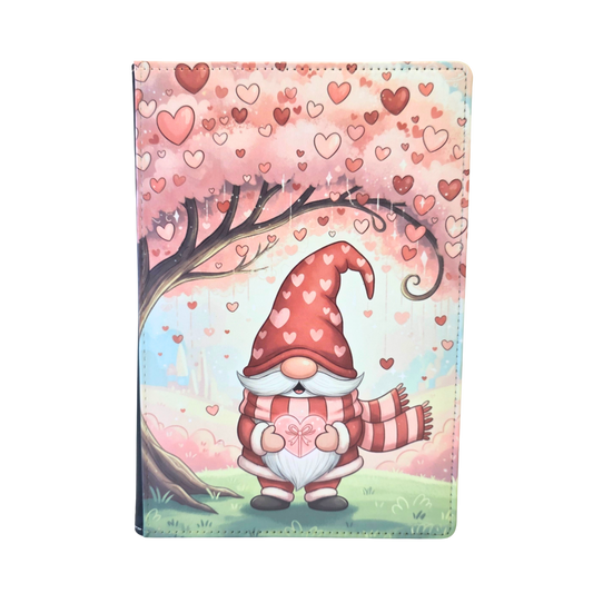 Journal cover with Gnome heart-themed design. A gnome standing beneath a pink tree. Pink and red hearts. 