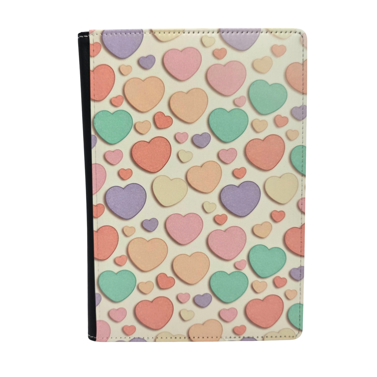 Journal cover with a colorful candy heart pattern in pastel colors on a light yellow background.