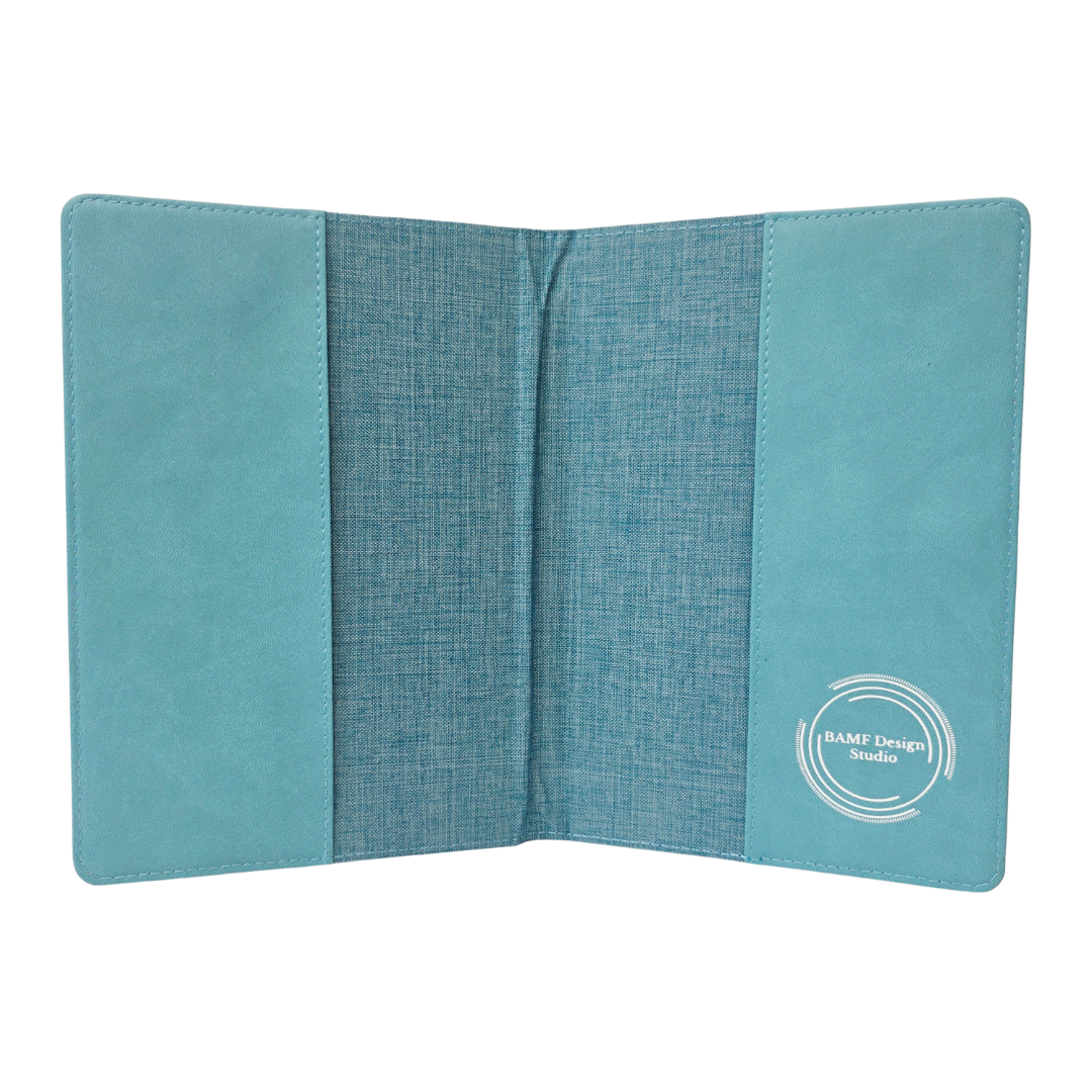 Inside of a blue fabric journal cover with a visible brand logo on a white background
