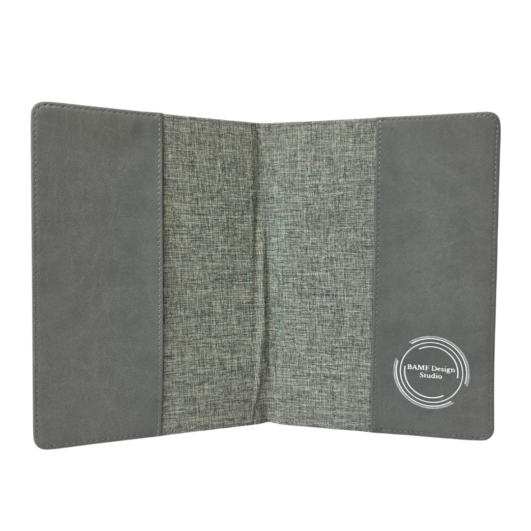 Gray fabric journal cover with a visible brand logo on a white background